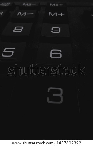 black and white keyboard keys with numbers and letters