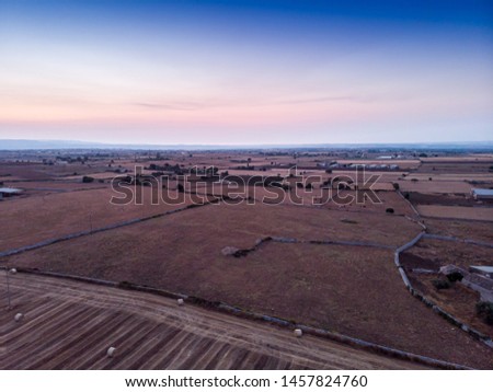 Aerial view of a rural field in the morning The shot is taken at early sunrise in a field in the southern Sicily, Italy