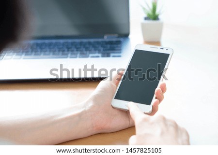 Business woman using laptop and smart phone stock photo