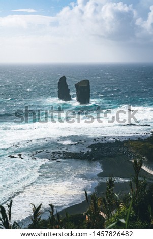 Aerial picture of wild rock formations in the middle of the open atlantic ocean next to Mosteiros, in Sao Miguel island, Azores, Portugal