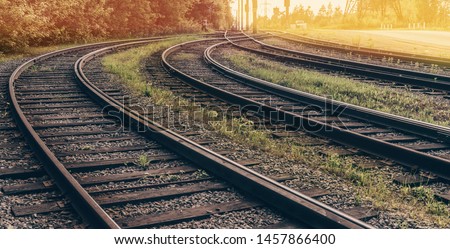 Railway to sunset. Intersection of old rails.  Royalty-Free Stock Photo #1457866400
