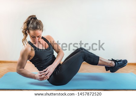 Crunches, High Intensity Interval Training or HIIT Royalty-Free Stock Photo #1457872520