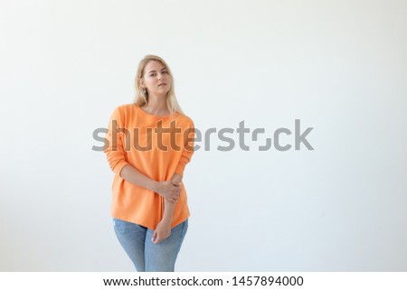 Portrait of pretty young woman in casual clothes posing on a white background. Space for reference links or advertising