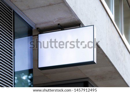 Blank store signboard mockup. Empty shop signage template mounted on the wall. Street sign.