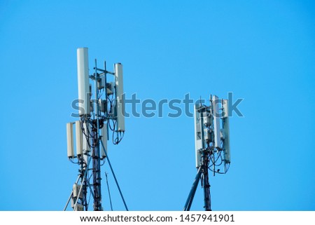 Telecommunication tower of 4G and 5G cellular. Base Station or Base Transceiver Station. Wireless Communication Antenna Transmitter. Telecommunication tower with antennas against blue sky background.