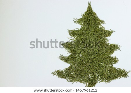 Fir tree - symbol of Christmas and New Year, stylization shape made manually of spruce needles isolated on white background, Copy space
