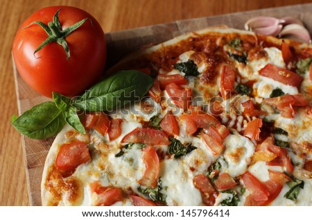 Home made tomato basil mozzarella pizza