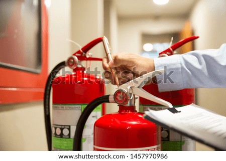 Check the gauge and the pressure of the fire extinguisher.