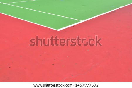 Empty Green Tennis Courts in the outdoors.