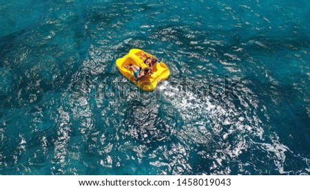 Aerial drone photo of sea bike with couple paddling in tropical exotic turquoise sea Royalty-Free Stock Photo #1458019043