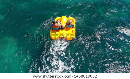 Aerial drone photo of sea bike with couple paddling in tropical exotic turquoise sea Royalty-Free Stock Photo #1458019052