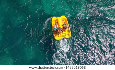 Aerial drone photo of sea bike with couple paddling in tropical exotic turquoise sea Royalty-Free Stock Photo #1458019058