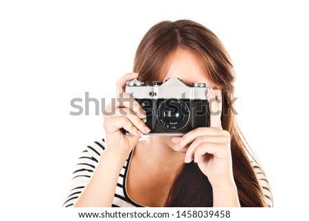 young woman with old camera isolated on a white background