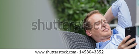 Young happy handsome Caucasian man with casual style look working on computer.