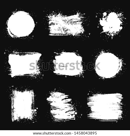 Paint brush stains, strokes, splatters and blots of different shapes for frame, banner, label, text box, clipping masks or other art design. Vector grunge textures isolated on black backgrounds. Royalty-Free Stock Photo #1458043895