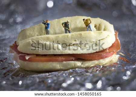 Miniature people : Workers work bread. Use as a concept of the day of work