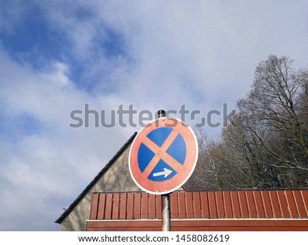 Strict prohibition of holding in the old town of Oerlinghausen with blue sky and white clouds in East Westphalia in Germany