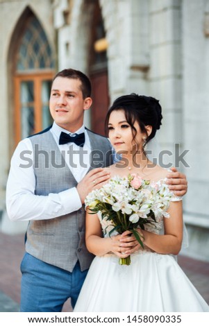 The guy and the girl are smiling at each other.