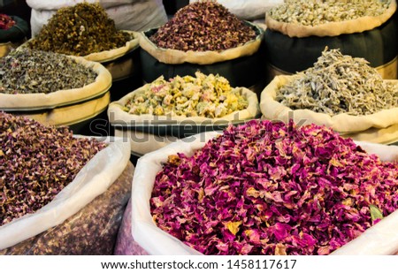 lower petals and spices in big bags on the market. Eastern market of spices and seasonings Royalty-Free Stock Photo #1458117617