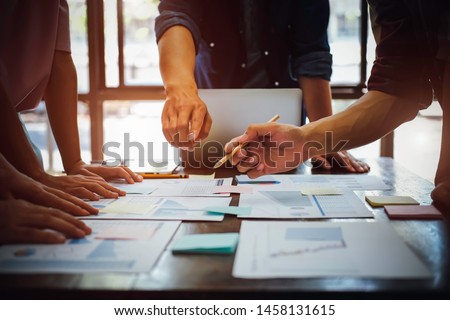 Asian business adviser meeting to analyze and discuss the situation on the financial report in the meeting room.Investment Consultant,Financial Consultant,Financial advisor and accounting concept Royalty-Free Stock Photo #1458131615