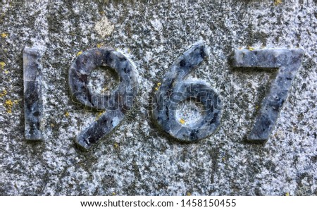 The year 1967 carved in granite with the figures polished – a detail of an inscription produced that year