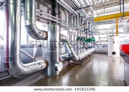 interior of an industrial boiler, the piping, pumps and motors Royalty-Free Stock Photo #145823348