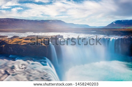 Bright summer view of Skjalfandafljot river, Iceland, Europe. Fantastic morning scene of Godafoss, spectacular waterfall plunging over a curved, 12m-high precipice, with paths to various viewpoints. 