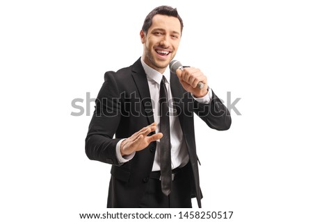 Young handsome man with a microphone in his hand isolated on white background