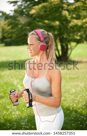 Young Beautiful Woman Exercising in the Nature