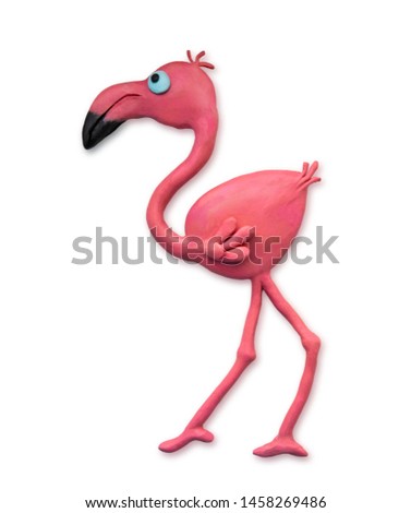 Plasticine cartoon flamingo closeup isolated on white background. Plasticine bird cast by hand. View from above. Crafts from plasticine