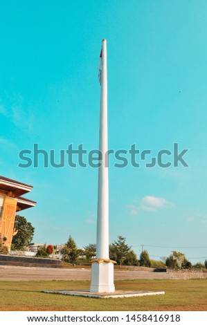 Flag pole on blue sky background