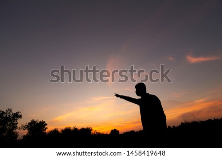 Black silhouette man and beautiful sunlight color. Encouragement and fighting various obstacles.