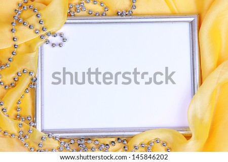 Empty frame on beautiful silk background