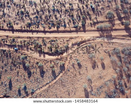 This set of photos are of the 2019 Finke Desert Race held at Alice Springs, NT, Australia, taken with a downward angle catching off road racing from above. Royalty-Free Stock Photo #1458483164
