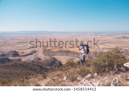 backpacker traveler with hat and white shirt