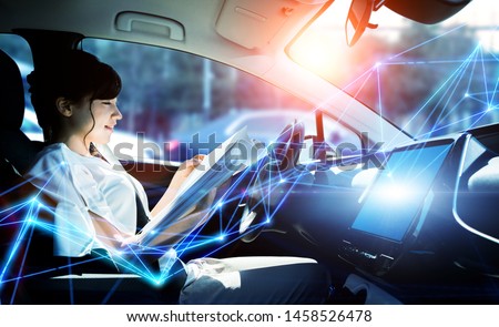 Interior of autonomous car. Driverless vehicle. Self driving. UGV. Advanced driver assistant system. Royalty-Free Stock Photo #1458526478