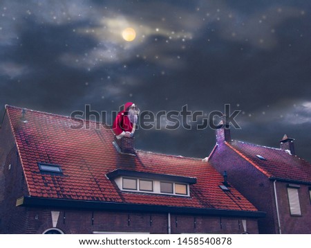 Night, blue dark sky with stars. Santa Claus sitting in a chimney and looking at distance. Royalty-Free Stock Photo #1458540878