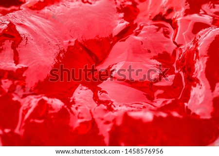 Delicious red fruit jelly as background, closeup