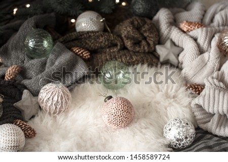 Christmas background. knitted sweater and christmas decoration on a light background, top view. Holiday still life