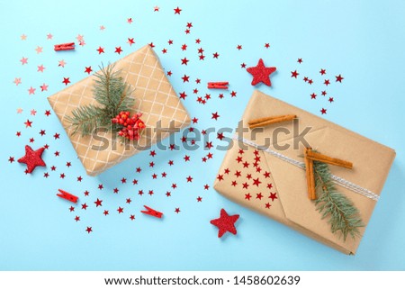 Composition with beautiful Christmas gift boxes on color background