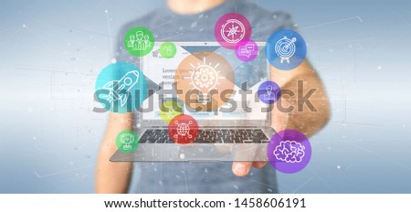 View of a Businessman holding a Cloud of colorfull start up icon bubble with a laptop 3d rendering