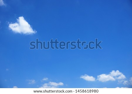 White clouds on blue sky background. Blue sky with white cloud. Clearing day and Good weather in the afternoon. Heart-shaped clouds on blue sky background.