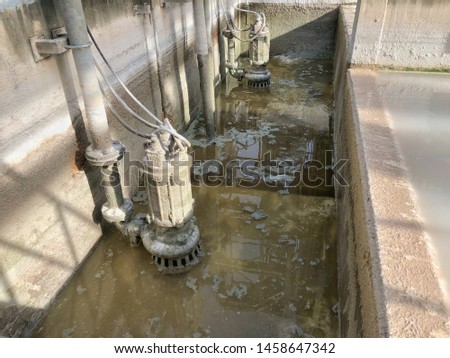 Waste water treatment pit with submersible pump Royalty-Free Stock Photo #1458647342