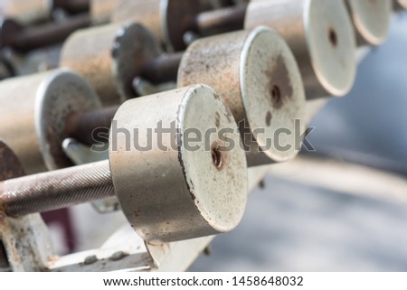 Weight liftingFocus on a part of a blackweight lifting steel balls placed on the track,blured background