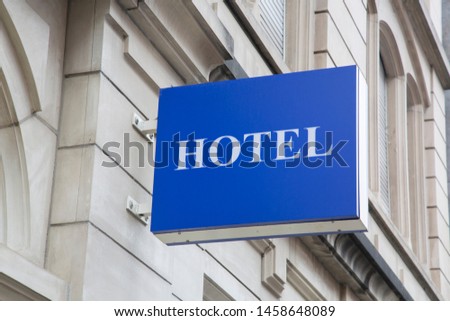 Blue Hotel Sign on Building Facade