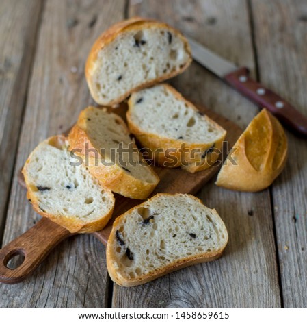 sliced sourdough bread loaf on the wooden table flat lay rustic food photography