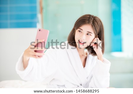 beauty asian woman take phone selfie with bathrobe 