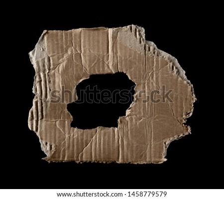 Cardboard scraps isolated on black background and texture
