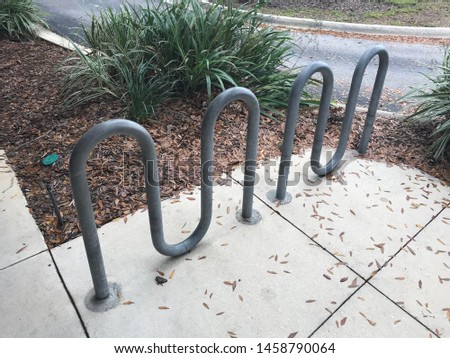 7 Loop wave Bike Rack in sidewalk. Photo image
