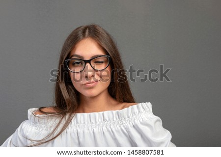 Emotional young woman portrait on dark background.